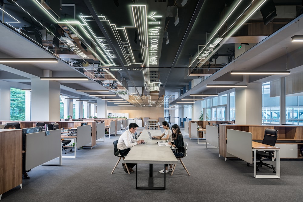 A team collaborating in a warm, well-furnished modern office.