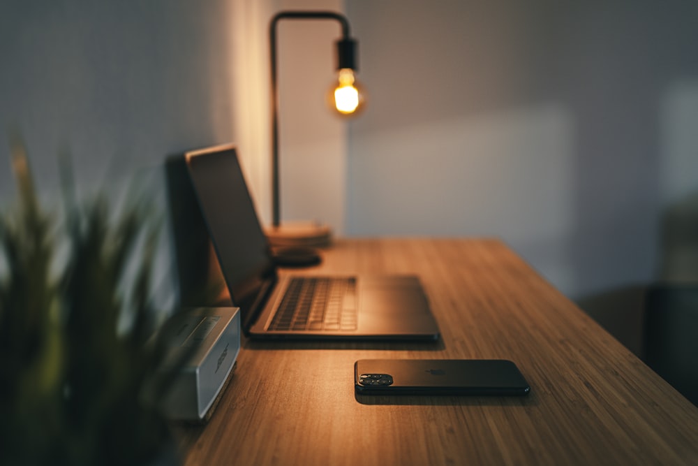 Premium wooden desk with a lamp in a warm, modern office.
